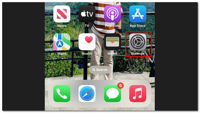 tap settings app on iphone