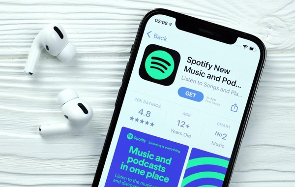 переустановить Spotify на iPhone